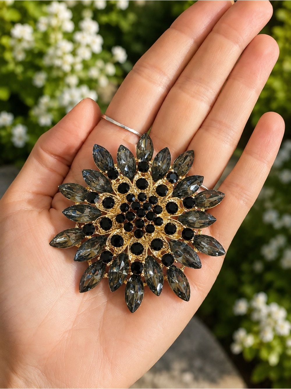 Large Gold-Tone Black and Smokey Crystal Floral Brooch